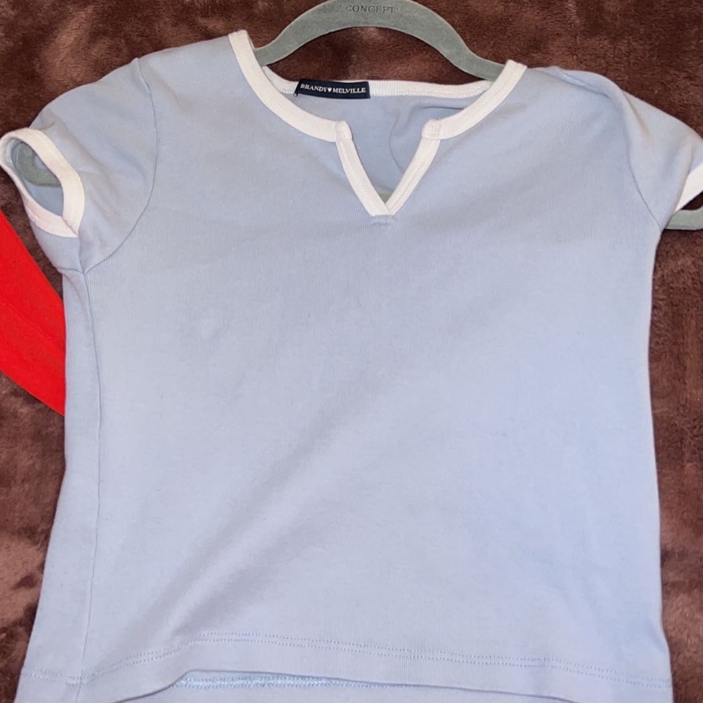 Blue and white brandy Melville tee. Tight around armpits, on me at least